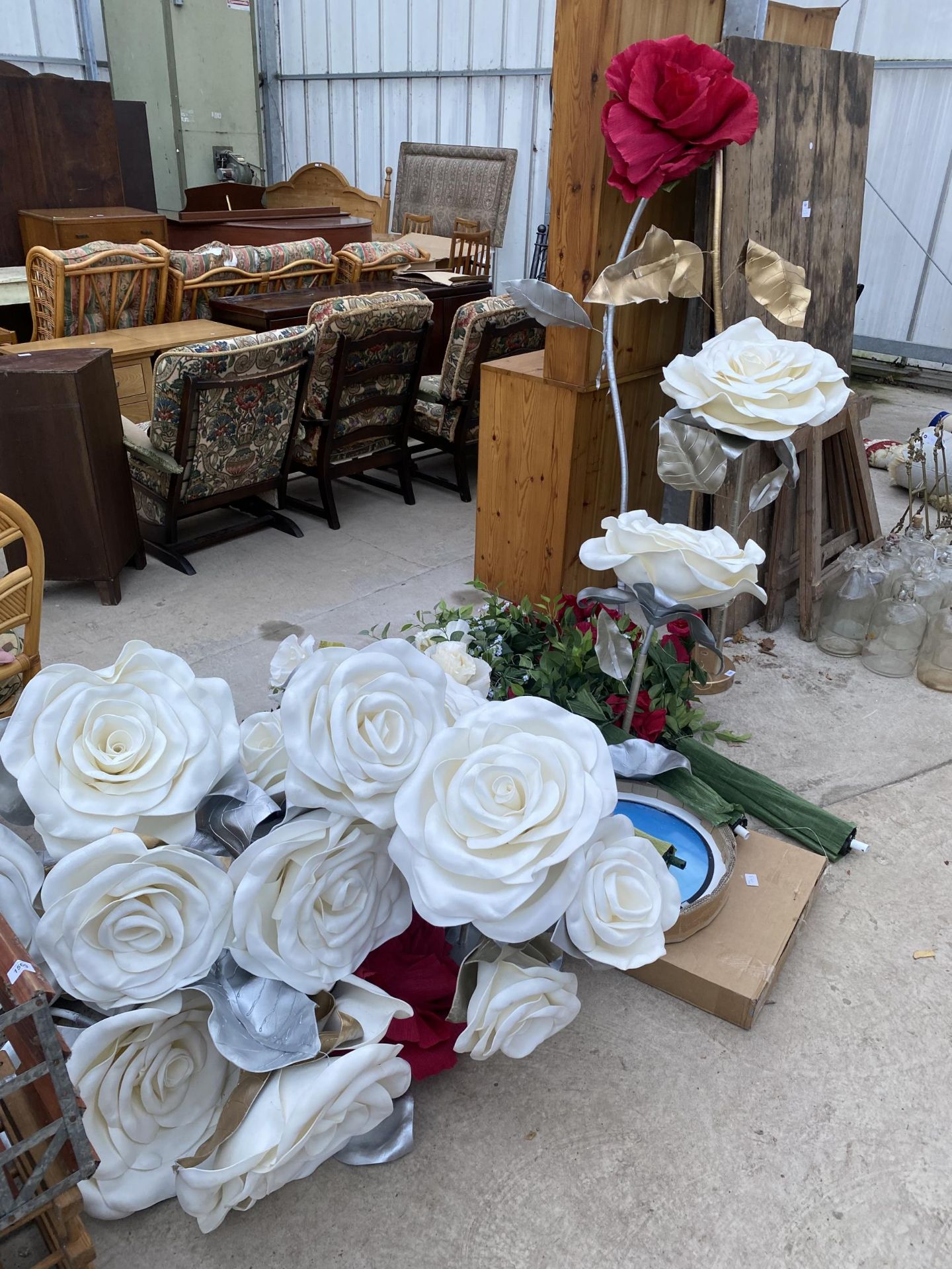 A LARGE QUANTITY OF ARTIFICIAL WEDDING FLOWERS AND DECORATIONS