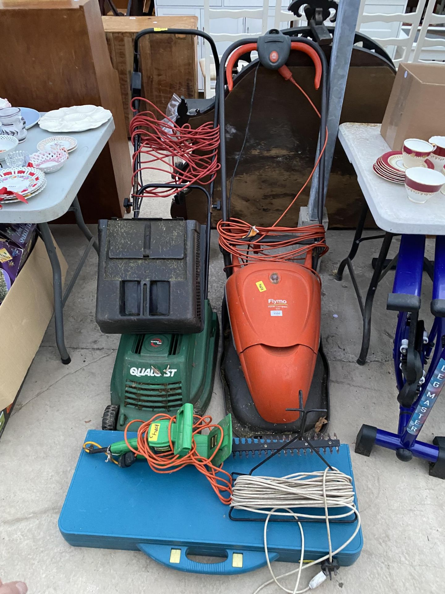 A FLYMO ELECTRIC LAWN MOWER, A QUALCAST ELECTRIC LAWN MOWER AND AN ELECTRIC HEDGE TRIMMER ETC