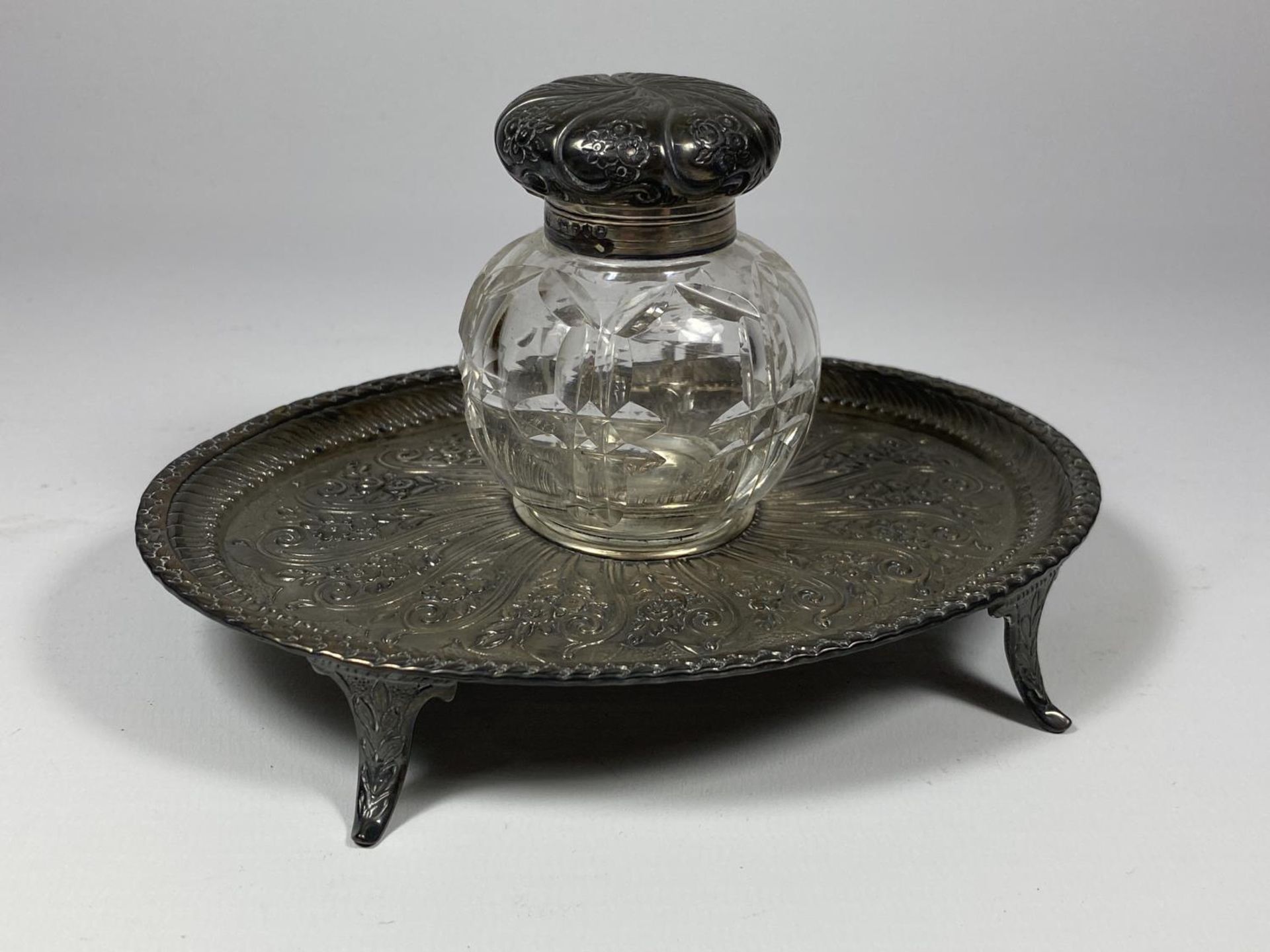 A SILVER PLATED DESK STAND WITH VICTORIAN HALLMARKED SILVER LIDDED INK BOTTLE