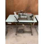 A VINTAGE SINGER INDUSTRIAL SEWING MACHINE WITH TREADLE BASE