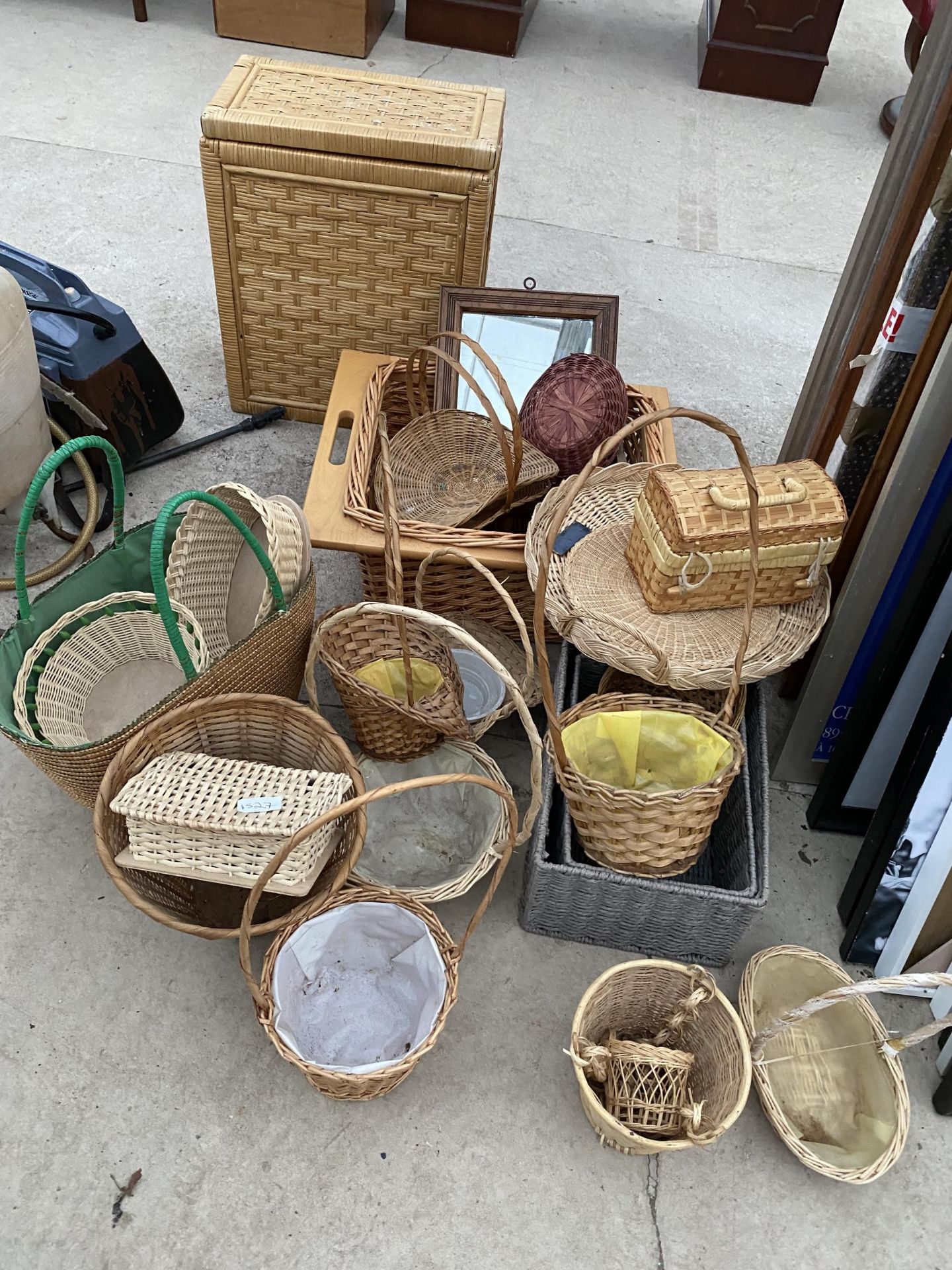 A LARGE QUANTITY OF WICKER BASKETS AND A SMALL DRESSING TABLE MIRROR