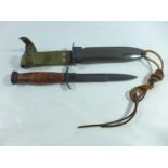 A UNITED STATES M3 FIGHTING KNIFE IN A M8A1 SCABBARD, 16CM BLADE