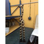 A WOODEN GIRAFFE HEIGHT 100CM