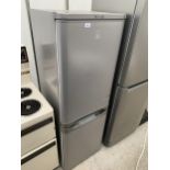 A SILVER INDESIT UPRIGHT FRIDGE FREEZER