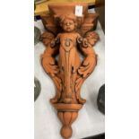 A HEAVY TERRACOTTA STYLE STONE CHERUB WALL HANGING SHELF / PLAQUE