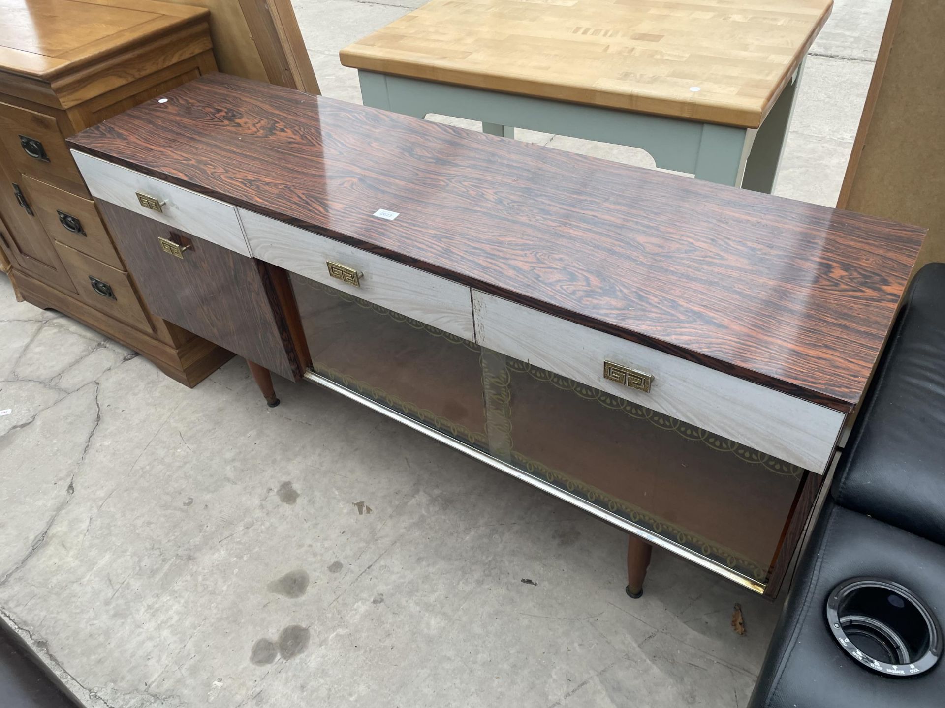 A MID 20TH CENTURY ROSEWOOD SIDEBOARD, 60" WIDE ENCLOSING THREE DRAWERS AND CUPBOARDS