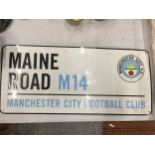 A 'MAINE ROAD' MANCHESTER CITY METAL SIGN 40CM X 18CM