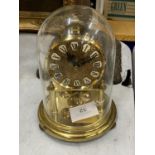 A 1950'S BRASS CASED 'KUNDO' ANNIVERSARY CLOCK WITH GLASS DOME