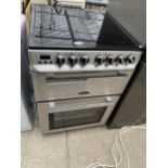 A STAINLESS STEEL AND BLACK FREE STANDING RANGEMASTER OVEN AND HOB