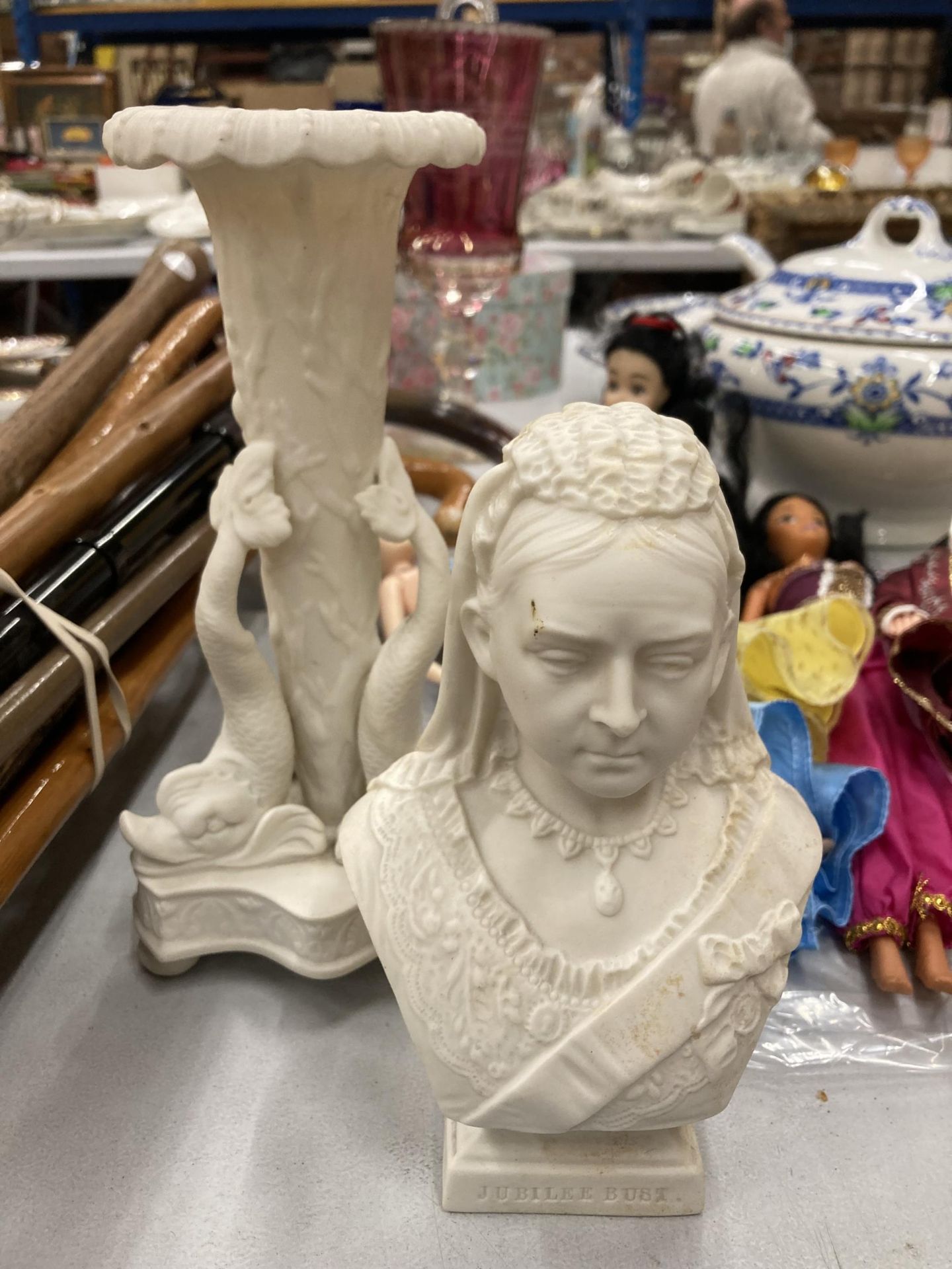 TWO PIECES OF PARIEN WARE TO INCLUDE A BUST OF QUEEN VICTORIA AND A VASE WITH FISH DECORATION