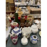 A MIXED LOT OF CERAMICS TO INCLUDE VASES, BOWLS, A SUGAR CANNISTER, TEAPOTS, STONEWARE BOTTLES, ETC