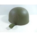 A GREEN PAINTED PARATROOPERS TYPE METAL HELMET AND LINER