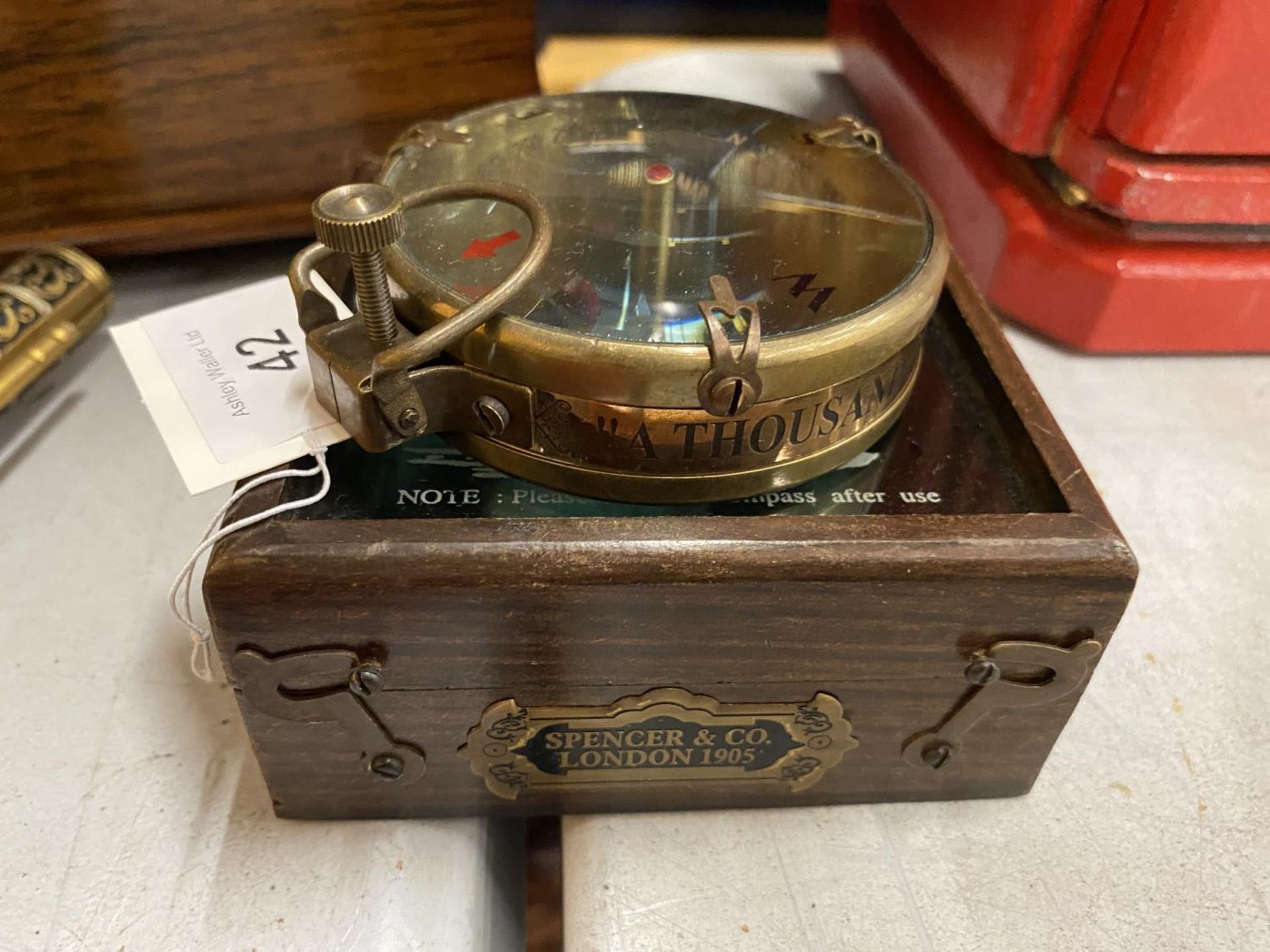 A COLLECTABLE BRASS SHIPS COMPASS IN WOODEN BOX