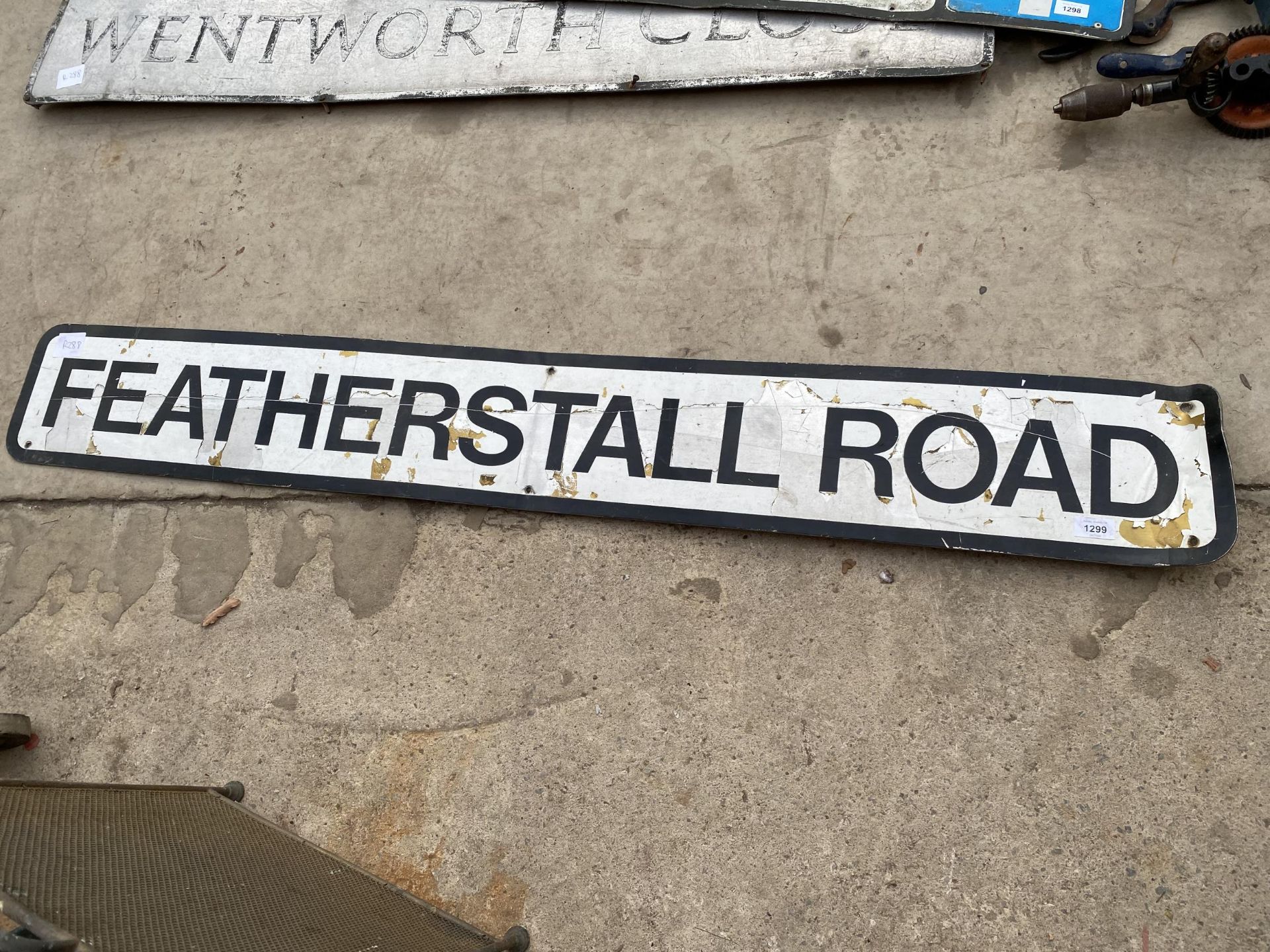 A VINTAGE METAL 'FEATHERS TALL ROAD' ROAD SIGN