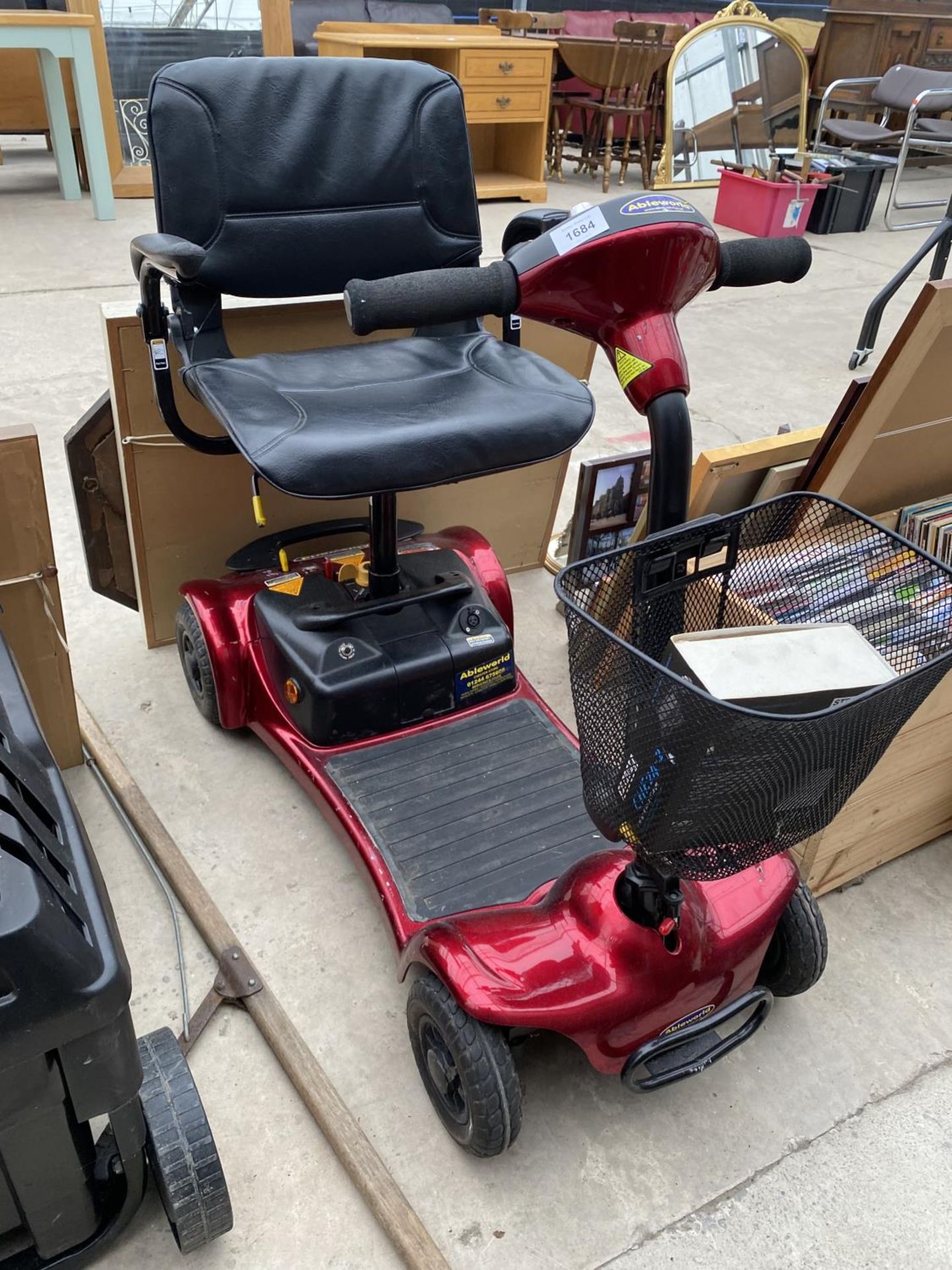 AN ABLEWORLD MOBILITY SCOOTER WITH KEY AND CHARGER