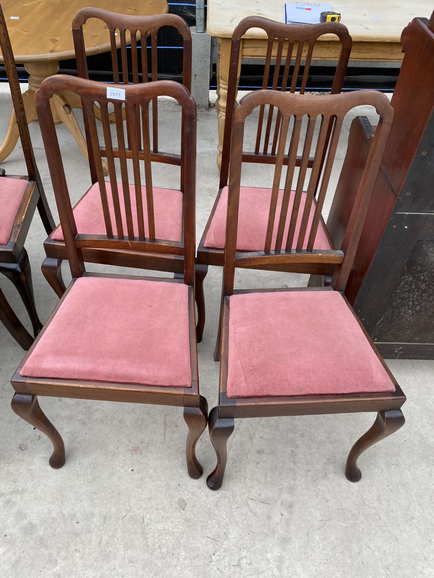 A SET OF FOUR EDWARDIAN MAHOGANY PARLOUR CHAIRS ON CABRIOLE LEGS BEARING LABEL 'RAY & MILS,