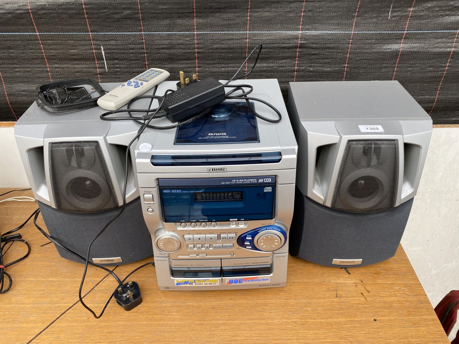 AN AIWA STEREO SYSTEM WITH CD CHANGER, TAPE CASETTE AND TWO SPEAKERS