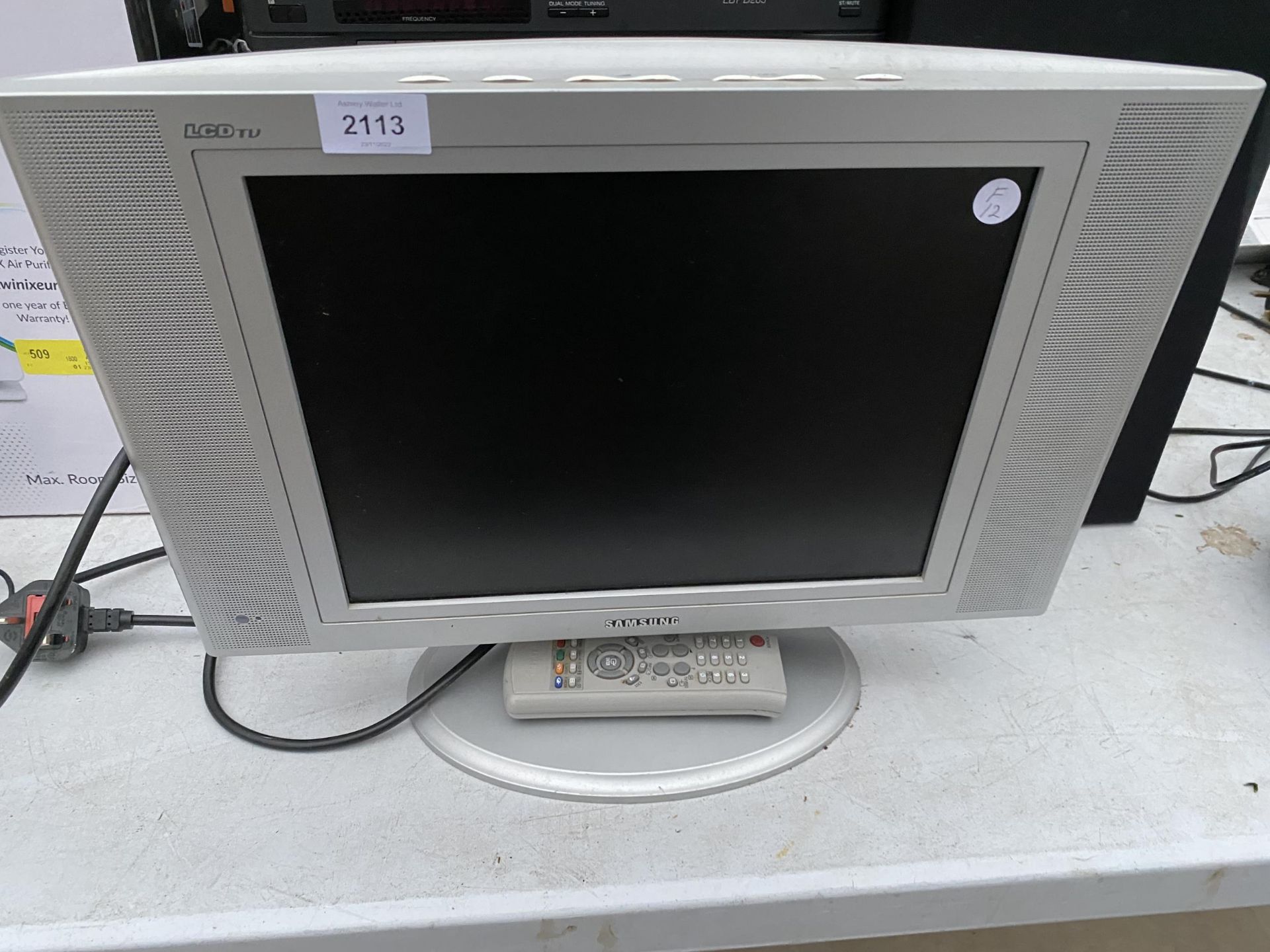 A SAMSUNG 15" TELEVISION WITH REMOTE CONTROL