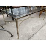 A MODERN GOLD COLOURED METALWARE COFFEE TABLE WITH GLASS TOP, 47X28"