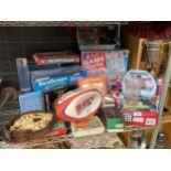 A LARGE ASSORTMENT OF GAMES AND TOYS TO INCLUDE A RUGBY BALL, TIDDLEY WINKS, A LABYRINTH AND AN 8 IN