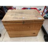 A VINTAGE STYLE WOODEN STORAGE CHEST WITH MONOGRAMMED SIDE