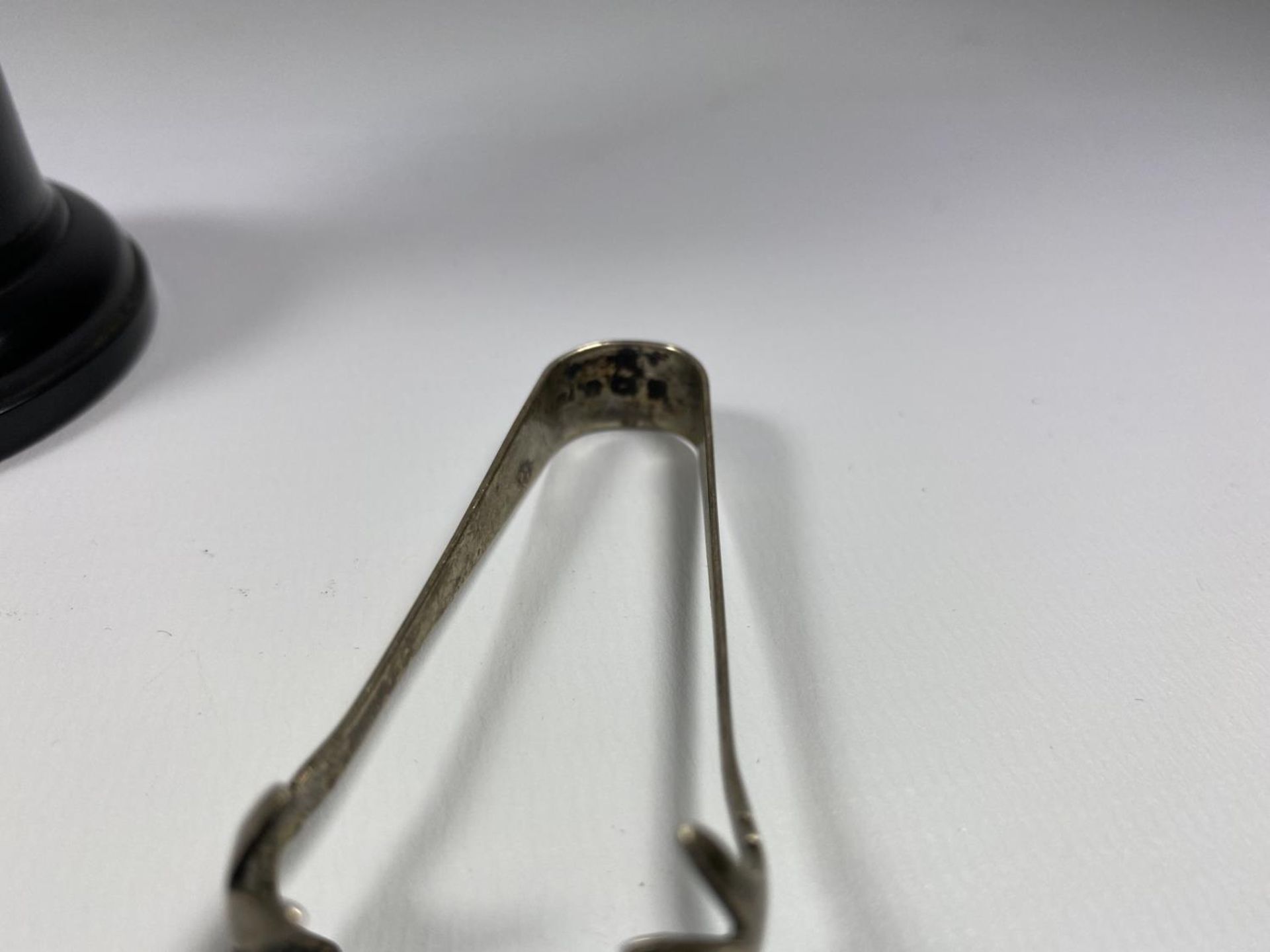 THREE HALLMARKED SILVER ITEMS - SMALL TROPHY ON BASE, TABLE SPOON AND SUGAR TONGS - Image 3 of 5