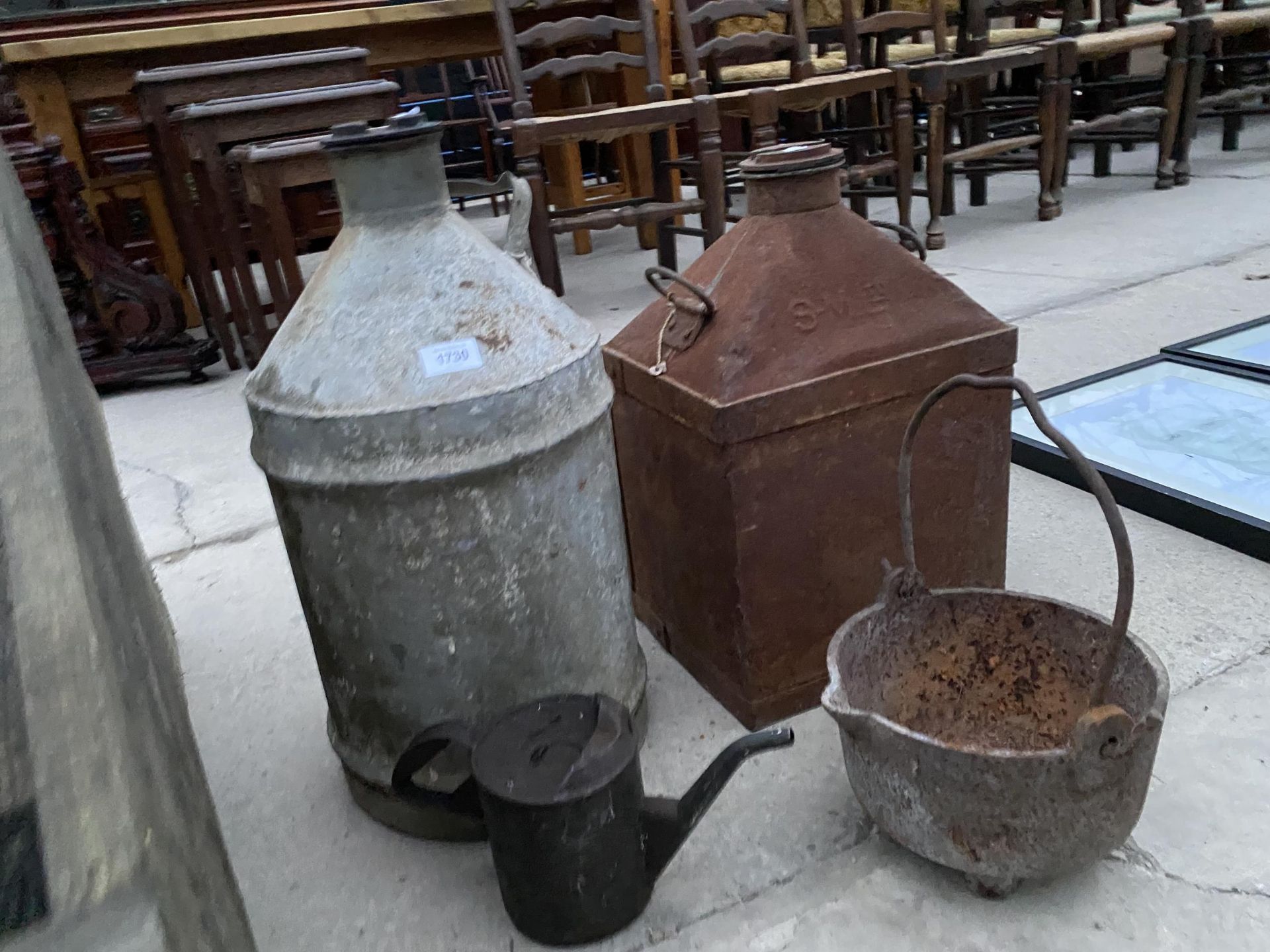 AN ASSORTMENT OF VINTAGE ITEMS TO INCLUDE TWO FUEL CANS, A CAST IRON COOKING POT AND AN OIL JUG - Image 2 of 2