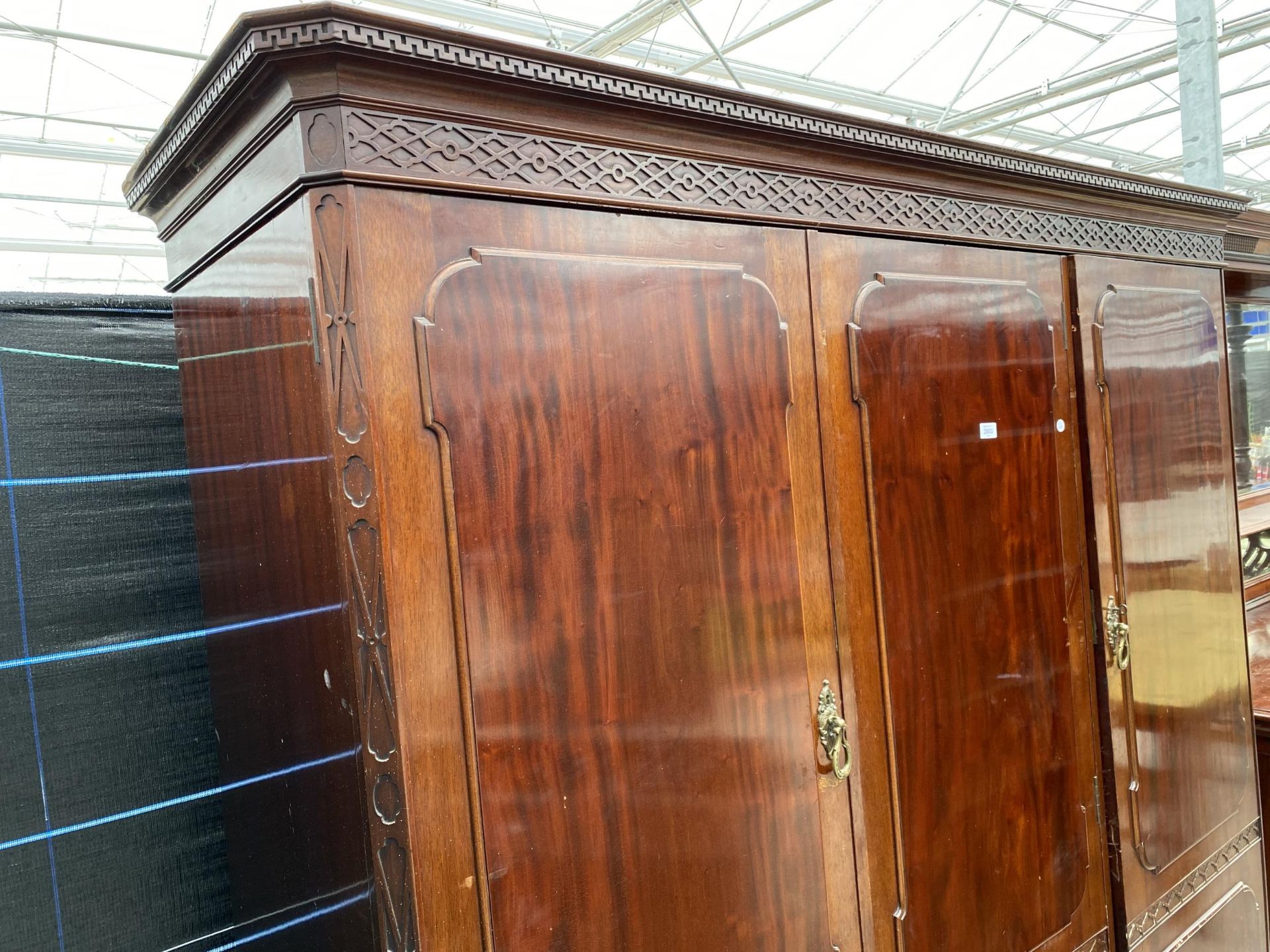 AN EDWARDIAN MAHOGANY 'CHIPPENDALE' STYLE TRIPLE WARDROBE ENCLOSING HANGING COMPARTMENTS, FIVE - Image 2 of 14