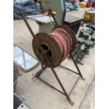 A VINTAGE HOSE REEL COMPLETE WITH HOSE