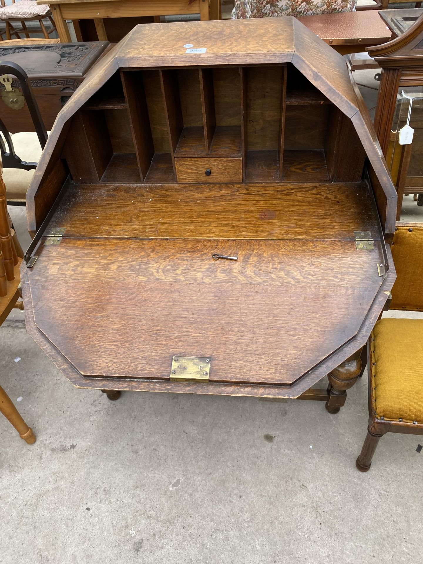 AN EARLY 20TH CENTURY OAK BUREAU WITH SARCOPHAGUS SHAPED TOP AND TWO DRAWERS, ON OPEN BASE, 29" WIDE - Image 5 of 7