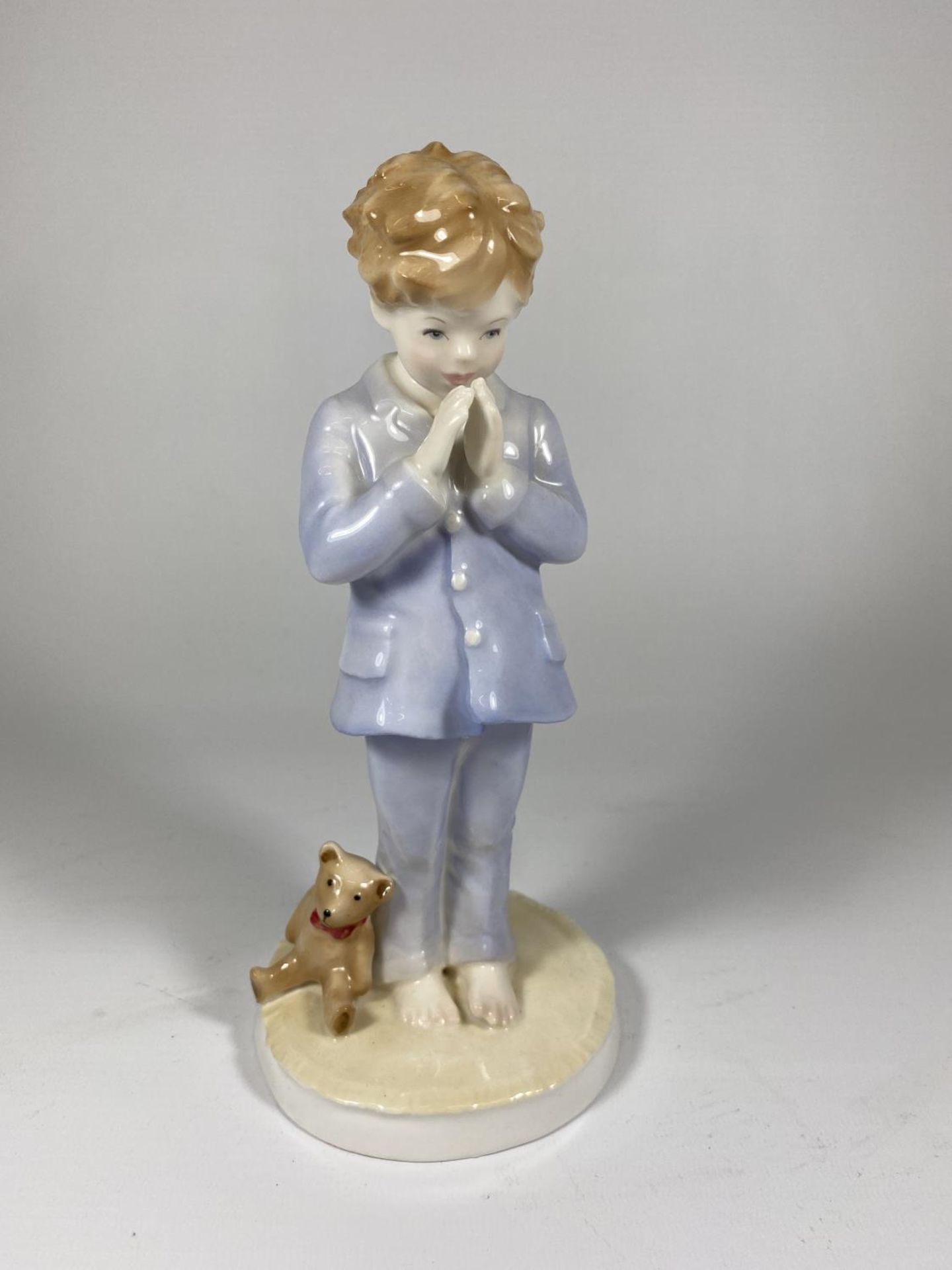 A ROYAL WORCESTER LIMITED EDITION MODEL OF A BOY - 'LUKE' NO. 1377/2000
