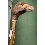 A VINTAGE WOODEN WALKING STICK WITH BIRD DESIGN HEAD