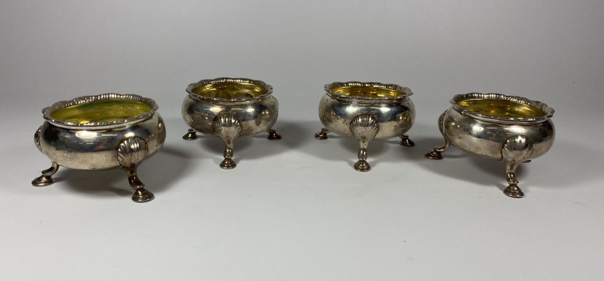 A SET OF FOUR GEORGE II SALT CELLARS ON HOOF FEET, DATES TO LONDON, 1752, TOTAL WEIGHT 392G