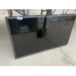 AN LG 32" TELEVISION WITH REMOTE CONTROL