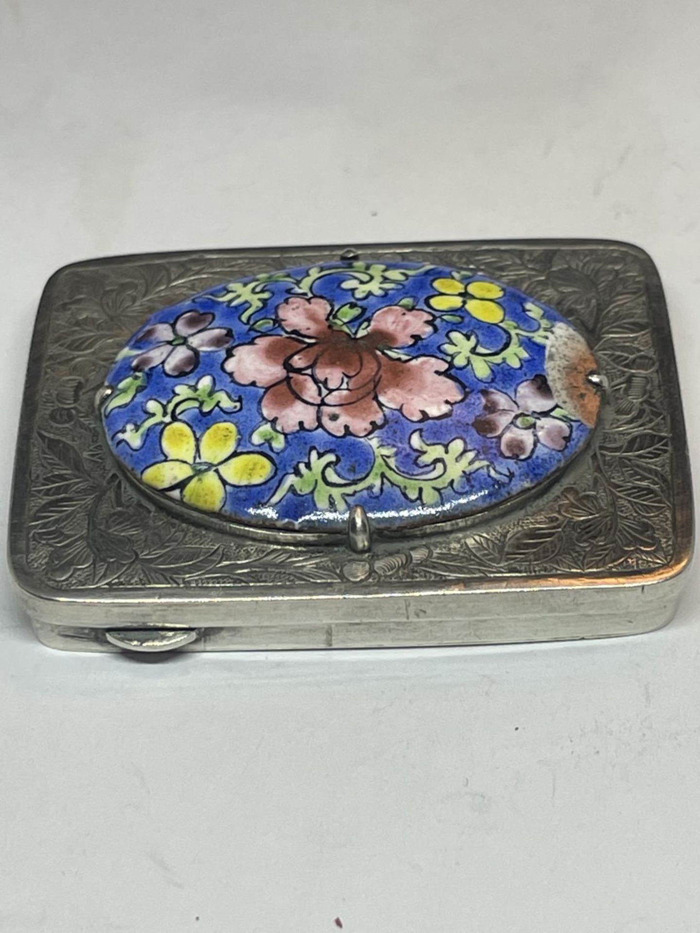 A DECORATIVE SILVER AND ENAMEL BOX