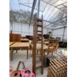 A VINTAGE THREE SECTION 27 RUNG EXTENDABLE LADDER