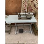 A VINTAGE PFAFF INDUSTRIAL SEWING MACHINE WITH TREADLE BASE