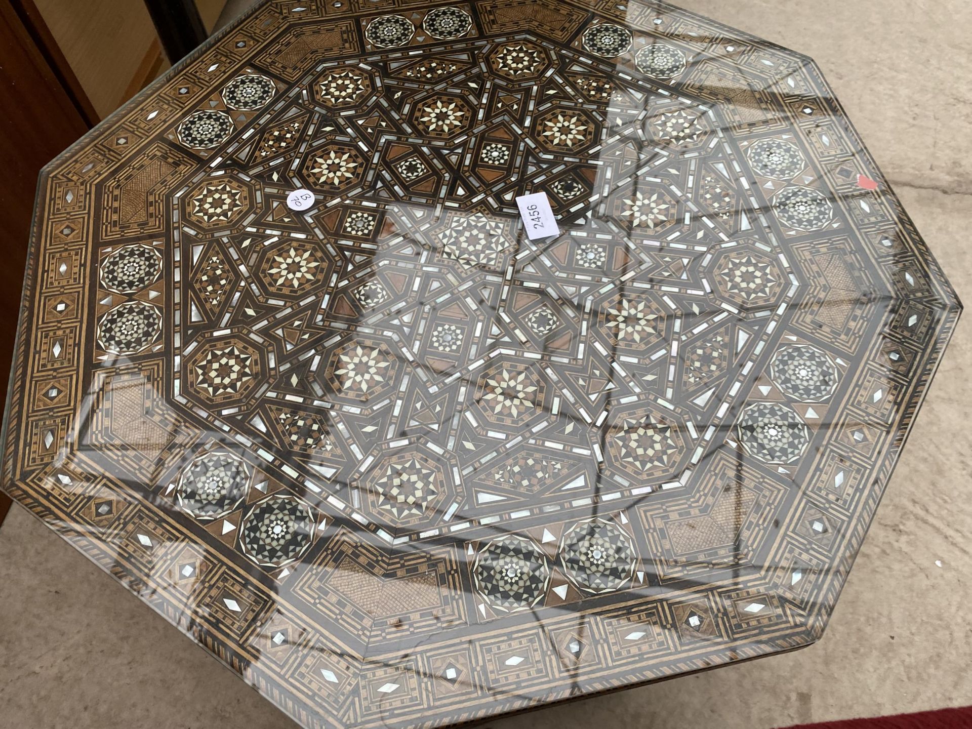 AN OCTAGONAL SYRIAN COFFEE TABLE PROFUSELY INLAID WITH MOTHER OF PEARL BEARING LABEL 'ABOUANI - Image 3 of 3