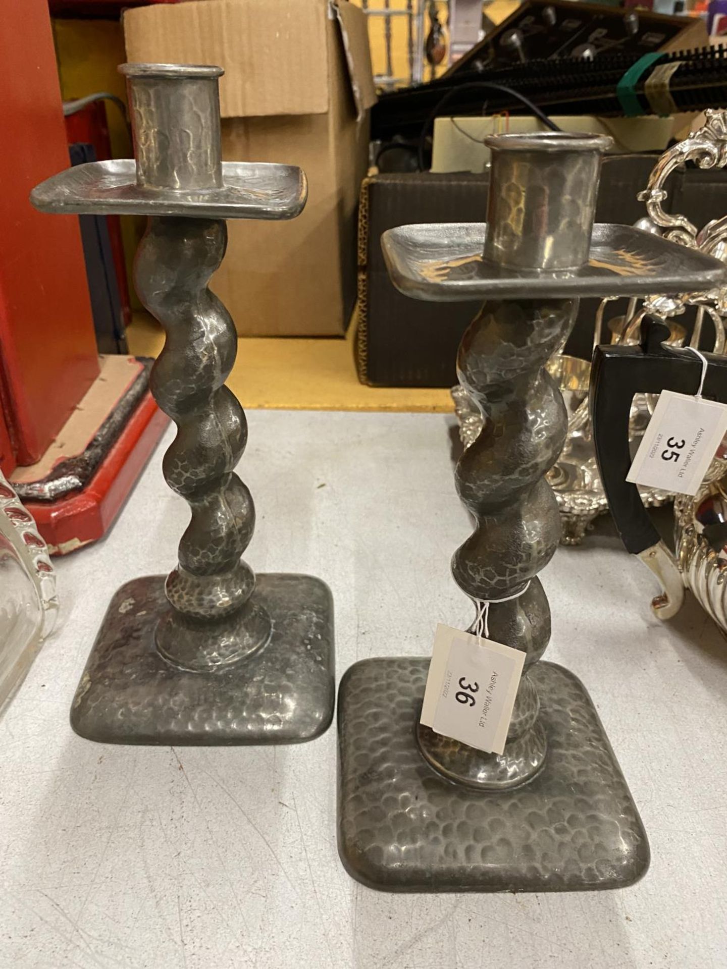 A PAIR OF VINTAGE PEWTER ARTS & CRAFTS CANDLESTICKS WITH TWISTED STEM DESIGN
