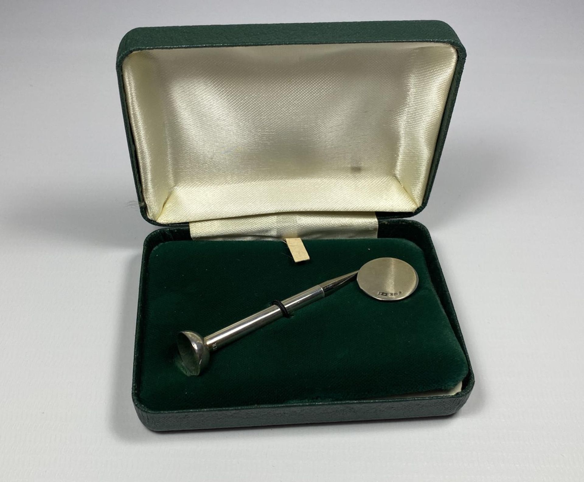 A BOXED STERLING SILVER GOLF TEE/PENCIL AND BALL MARKER