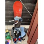 A SNOW BOARD WITH CARRY BAG, BINDINGS AND BOOTS ETC