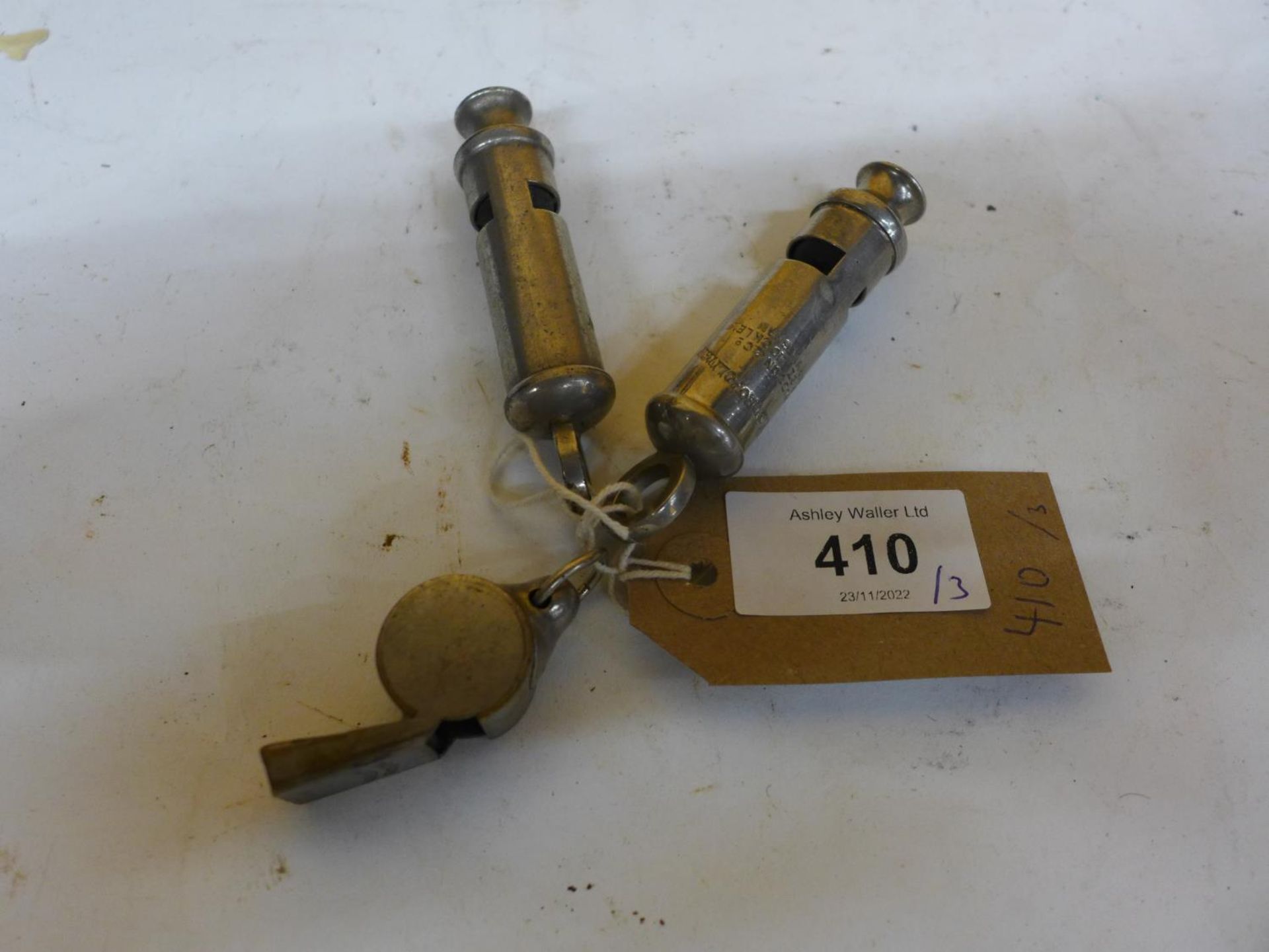 TWO METROPOLITAN WHISTLES AND AN ACME WHISTLE (3)