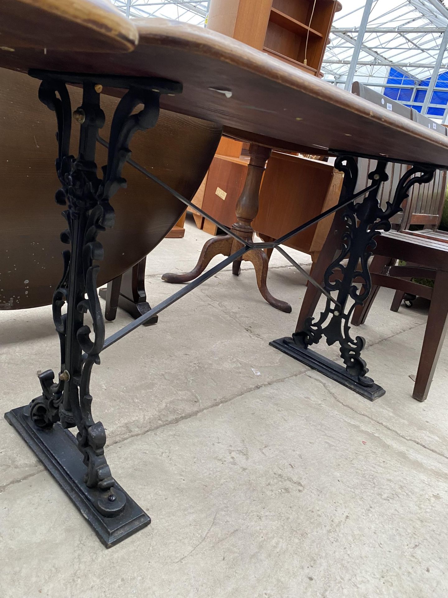 A PUB TABLE ON CAST IRON BASE, 48X27" - Image 2 of 4