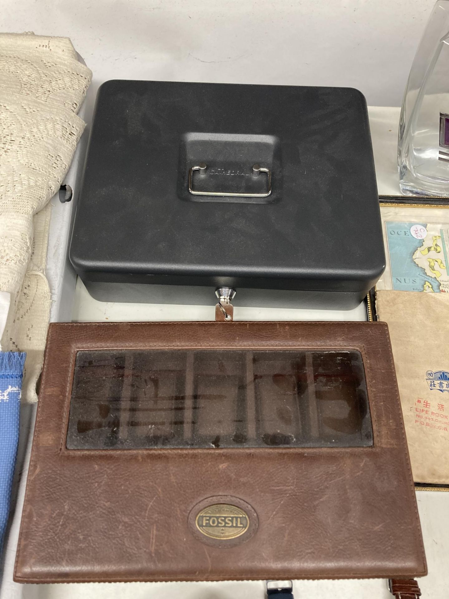 A METAL CASH BOX WITH KEY AND A FOSSIL BOX FOR FIVE WATCHES