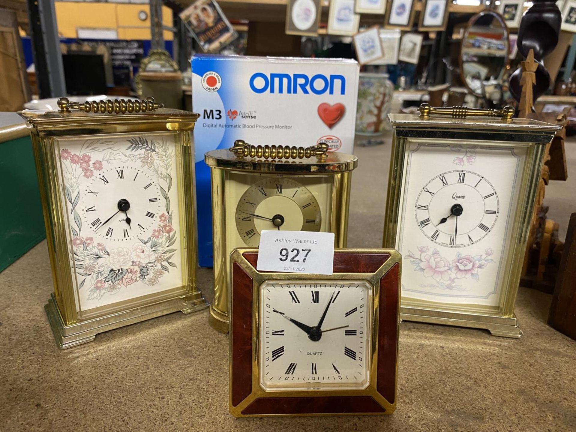 A QUANTITY OF CLOCKS TO INCLUDE THREE CARRIAGE CLOCKS, A BEDSIDE CLOCK AND AN OMRON DIGITAL BLOOD