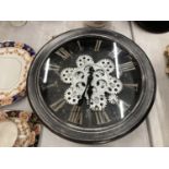A WALL CLOCK WITH EXPOSED MOVING PARTS DIAMETER 33CM