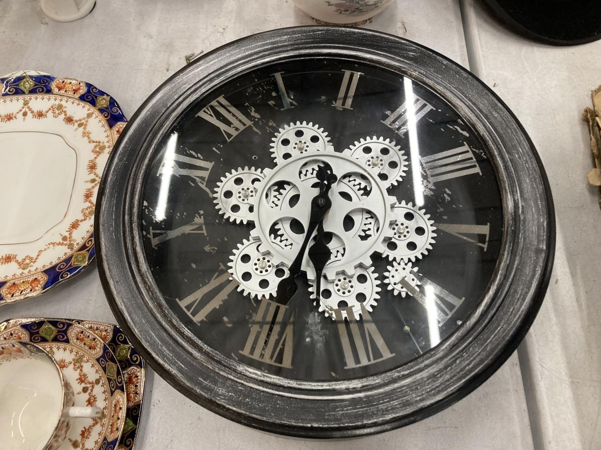 A WALL CLOCK WITH EXPOSED MOVING PARTS DIAMETER 33CM