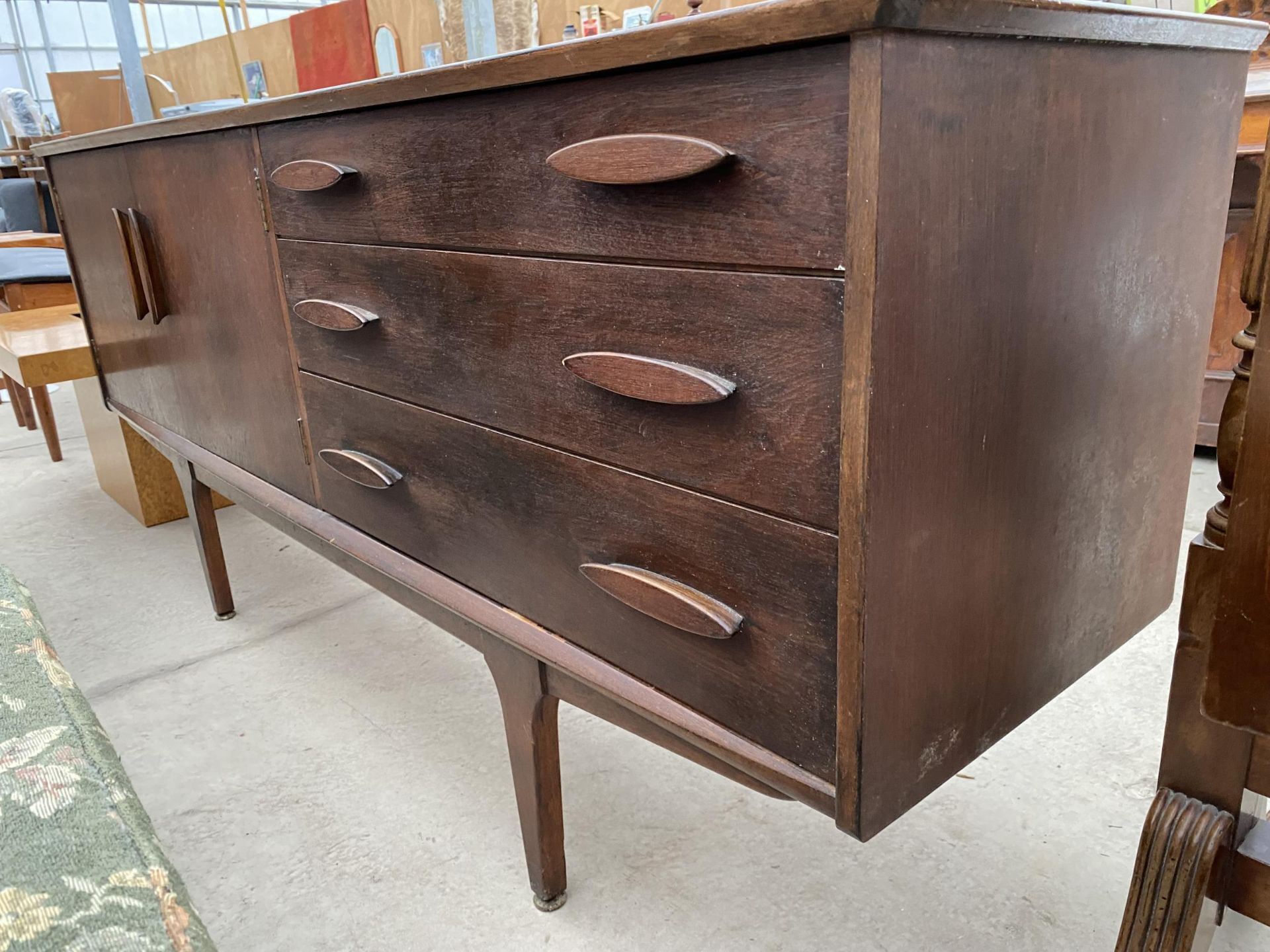 A TEAK 'JENTIQUE' SIDEBOARD, 66" WIDE, ENCLOSING THREE DRAWERS AND TWO CUPBOARDS - Image 2 of 5