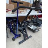 A HEALTH RIDER EXERCISE BIKE AND A LEG MASTER