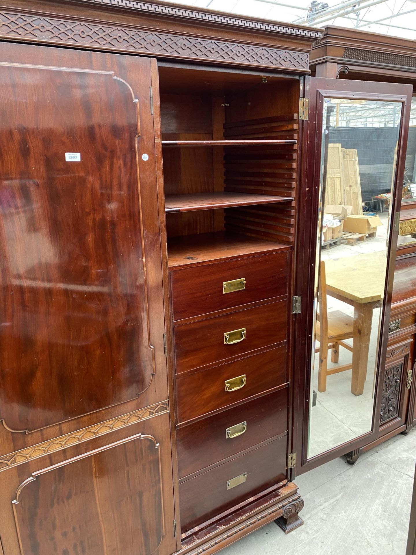 AN EDWARDIAN MAHOGANY 'CHIPPENDALE' STYLE TRIPLE WARDROBE ENCLOSING HANGING COMPARTMENTS, FIVE - Image 7 of 14